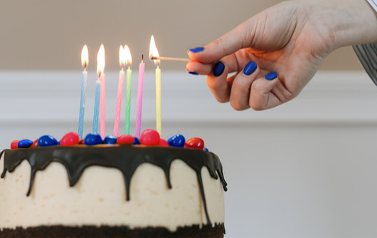 Cake with seven lit candles